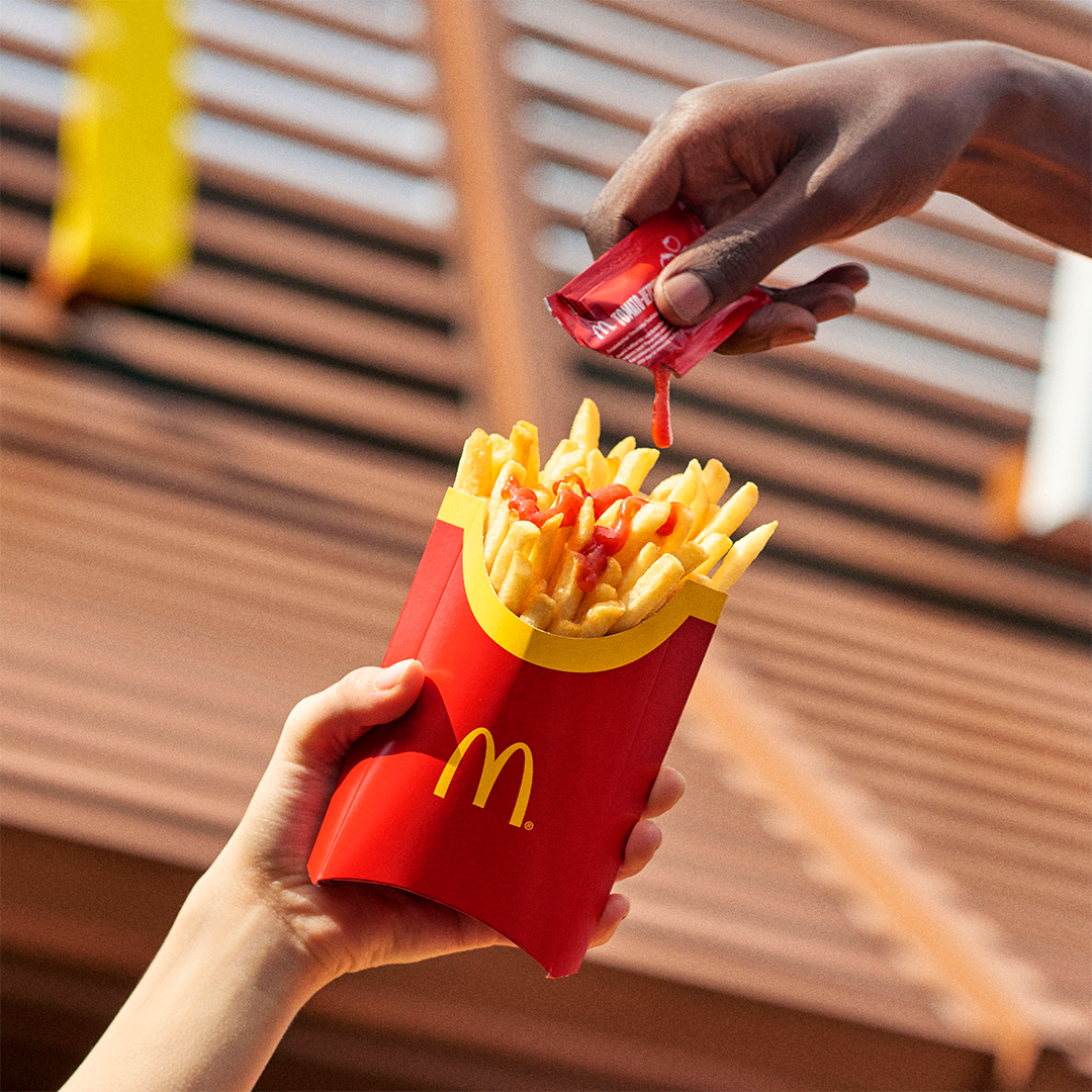 Someone Holding a Mcdonald Burger